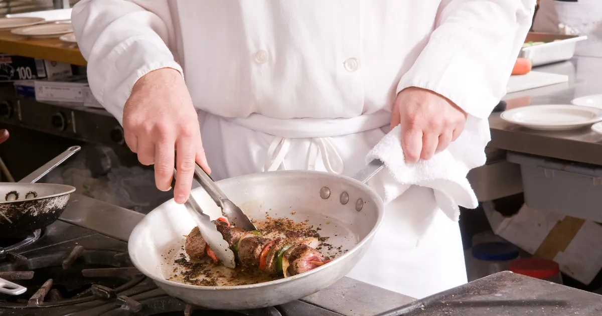 A professional kitchen featuring a high-quality gas range, ideal for fast-paced cooking and high-heat techniques.